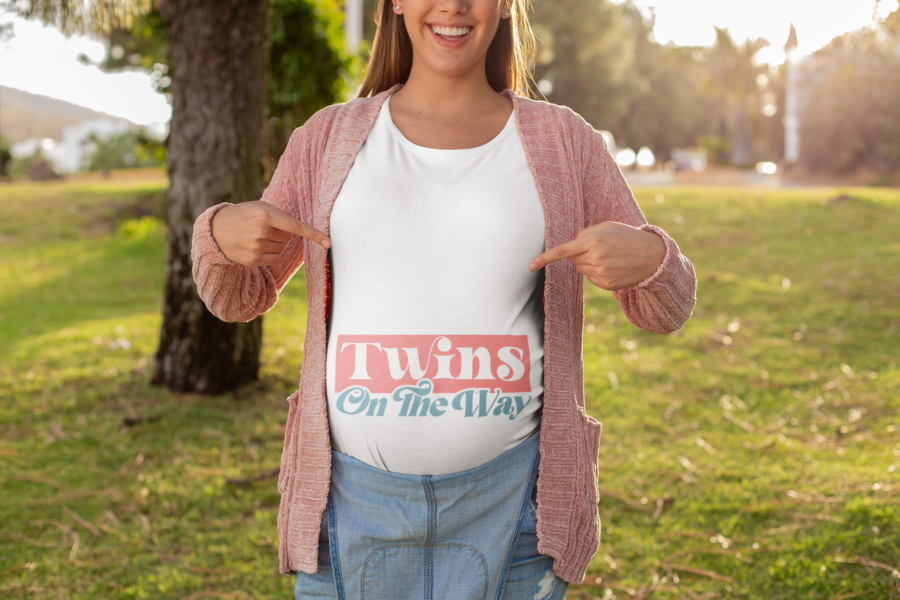 copy of mockup of a happy pregnant woman pointing at her t shirt 26671 - Dheeth By Nature